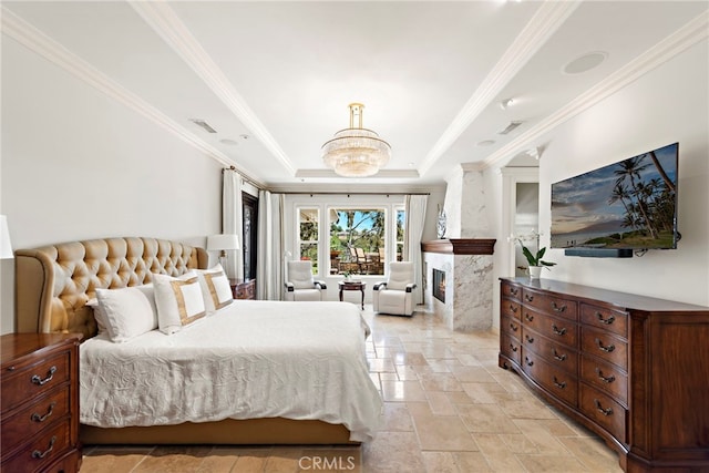 10 Corte Vizcaya, San Clemente, CA 92673 - bedroom with a tray ceiling, stone tile flooring, crown molding, a high end fireplace, and a chandelier