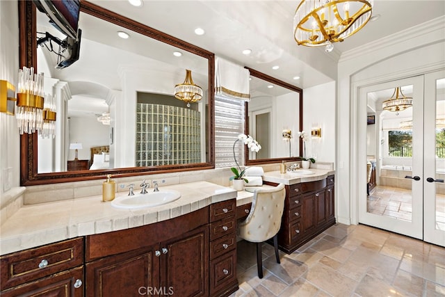 10 Corte Vizcaya, San Clemente, CA 92673 - full bath featuring a chandelier, vanity, crown molding, stone tile flooring, and recessed lighting