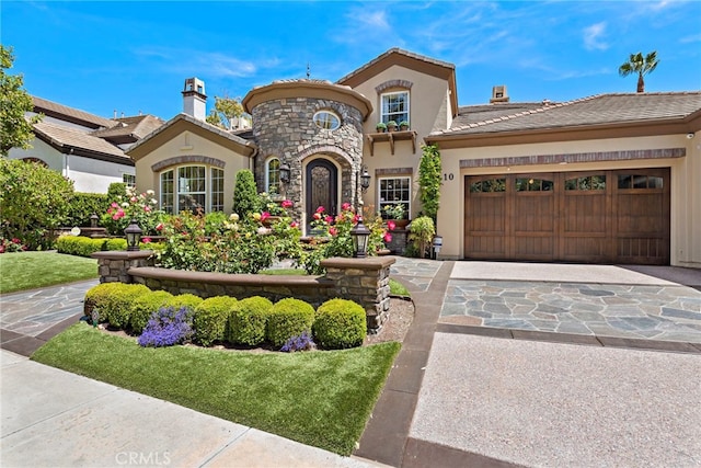 10 Corte Vizcaya, San Clemente, CA 92673 - mediterranean / spanish house with stucco siding, a garage, driveway, a chimney, and a tiled roof