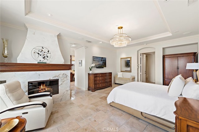 10 Corte Vizcaya, San Clemente, CA 92673 - bedroom with stone tile floors, a tray ceiling, a fireplace, ornamental molding, and a chandelier