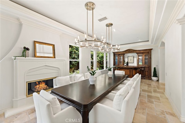 10 Corte Vizcaya, San Clemente, CA 92673 - dining room featuring stone tile floors, a chandelier, crown molding, baseboards, and a glass covered fireplace