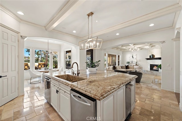 10 Corte Vizcaya, San Clemente, CA 92673 - kitchen with a sink, a chandelier, stone tile flooring, arched walkways, and light stone counters