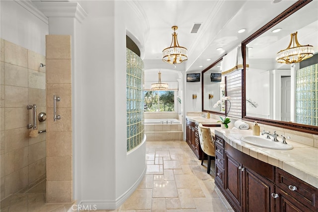 10 Corte Vizcaya, San Clemente, CA 92673 - bathroom featuring a chandelier, stone tile flooring, a bath, vanity, and walk in shower