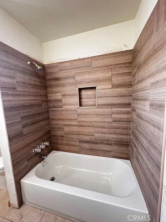 bathroom featuring shower / bathtub combination and tile patterned flooring