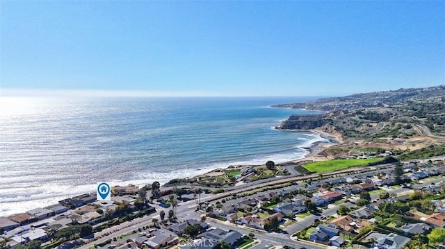 drone / aerial view featuring a water view and a residential view