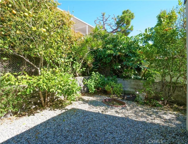 view of yard featuring a patio area and fence