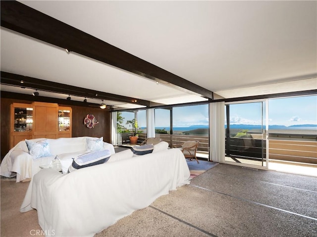 bedroom with beamed ceiling and a mountain view