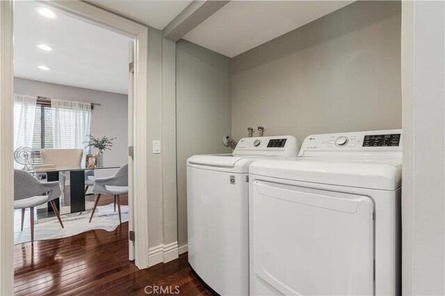 clothes washing area with washing machine and dryer, recessed lighting, laundry area, baseboards, and dark wood-style flooring