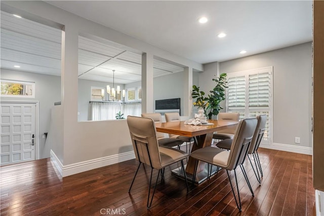 dining space featuring a chandelier, recessed lighting, baseboards, and wood-type flooring