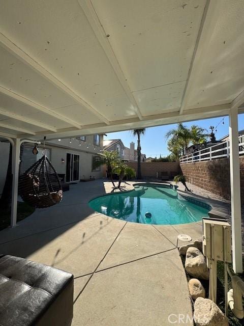 view of pool featuring a fenced in pool, a patio, and a fenced backyard