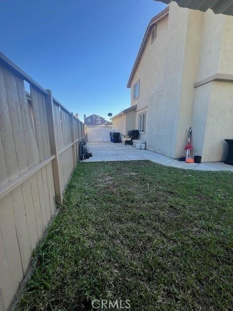 view of yard featuring a fenced backyard and a patio area