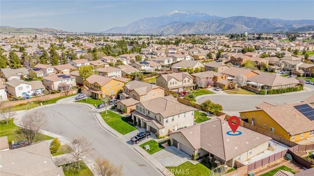 birds eye view of property featuring a residential view and a mountain view