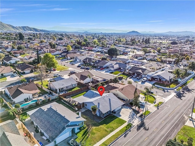 aerial view featuring a mountain view and a residential view