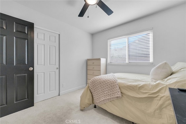 bedroom with baseboards, carpet floors, and ceiling fan