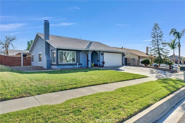 ranch-style home featuring an attached garage, a front lawn, fence, a chimney, and driveway