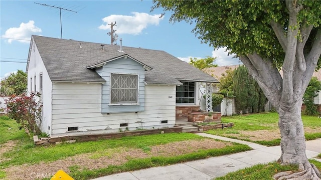 bungalow with crawl space, a front lawn, and a shingled roof