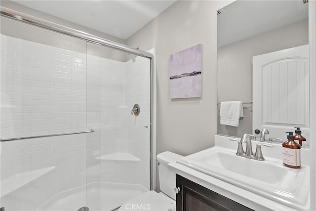 full bath featuring a shower stall, toilet, and vanity