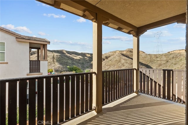 balcony featuring a mountain view