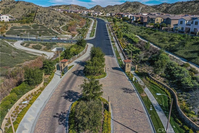 birds eye view of property featuring a mountain view and a residential view