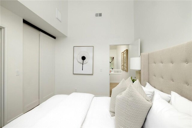 24877 Nueva Vista Dr Unit 23, Laguna Niguel, CA 92677 - bedroom featuring visible vents and a high ceiling