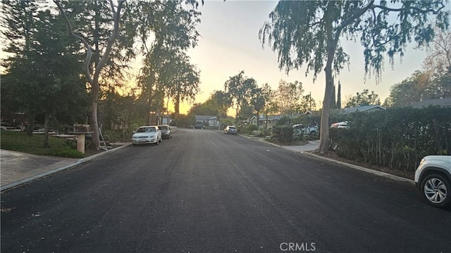 view of street featuring curbs