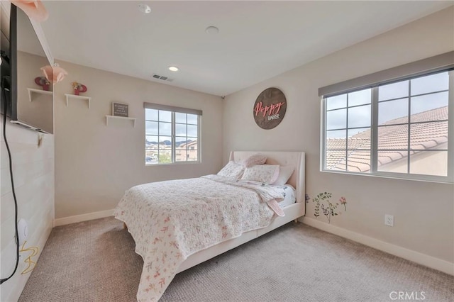 bedroom with visible vents, baseboards, and carpet floors