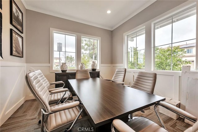 office space with wood finished floors, a wainscoted wall, recessed lighting, ornamental molding, and a decorative wall