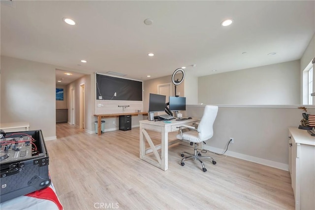 home office featuring light wood-style flooring, recessed lighting, and baseboards