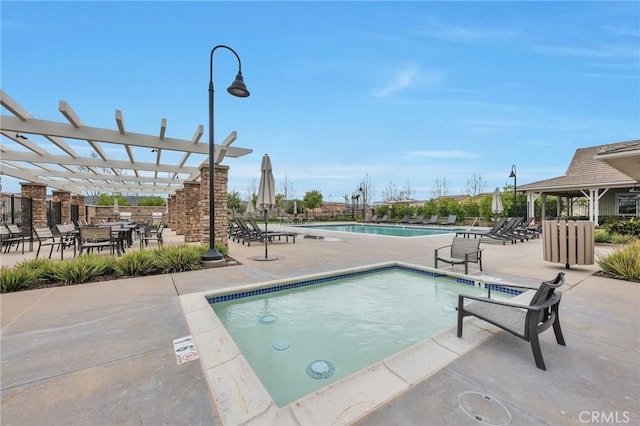 pool with a pergola and a patio