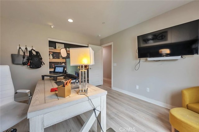 office area with recessed lighting, light wood-type flooring, and baseboards