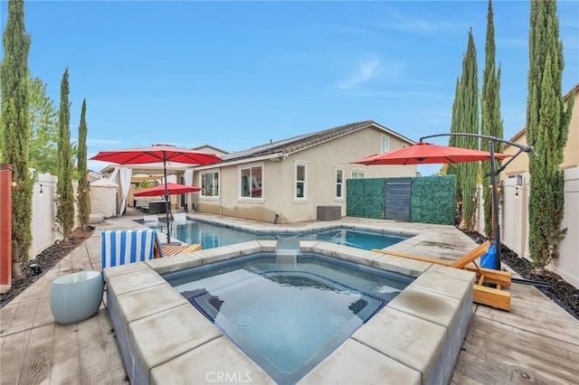 view of swimming pool with a fenced in pool, cooling unit, a fenced backyard, a patio area, and an in ground hot tub