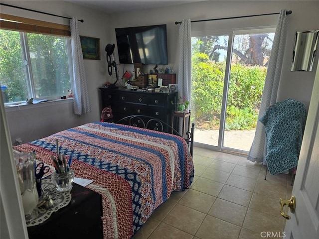 tiled bedroom featuring access to outside