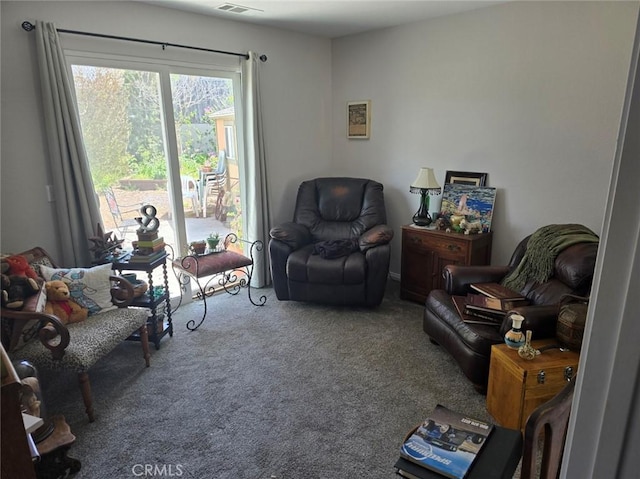 carpeted living room with visible vents