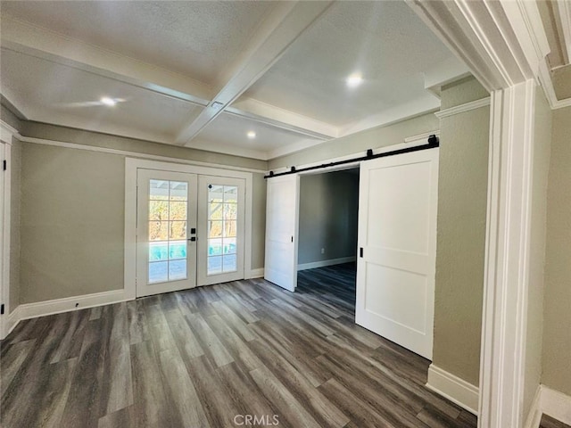 empty room with dark wood-style floors, beamed ceiling, french doors, and baseboards