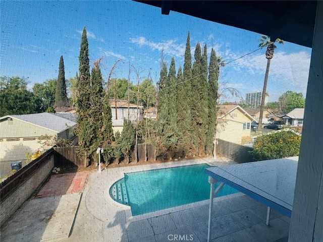 view of swimming pool with a fenced in pool, a patio, and a fenced backyard