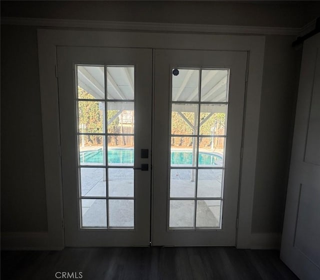 entryway featuring dark wood-style floors and french doors