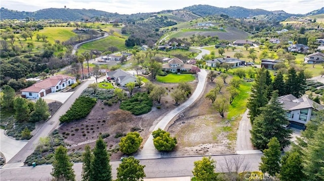 bird's eye view with a mountain view and a residential view