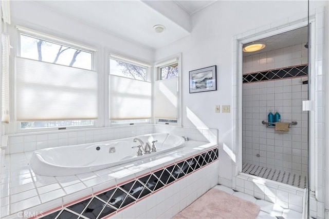 full bath featuring a shower stall and a garden tub