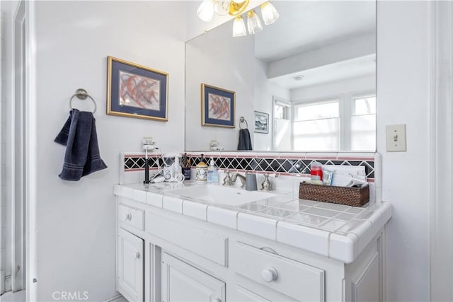 bathroom with vanity and backsplash