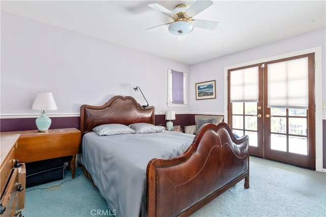 bedroom with french doors, light colored carpet, and ceiling fan