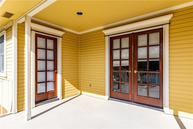 property entrance featuring french doors and visible vents