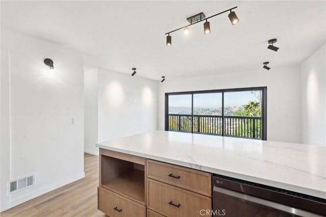 kitchen with baseboards, visible vents, light brown cabinetry, wine cooler, and light wood-style floors