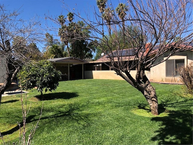 view of yard with a sunroom