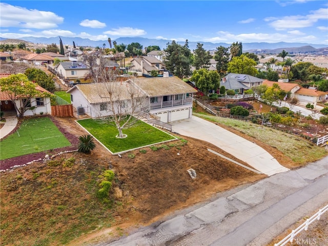 drone / aerial view featuring a mountain view and a residential view