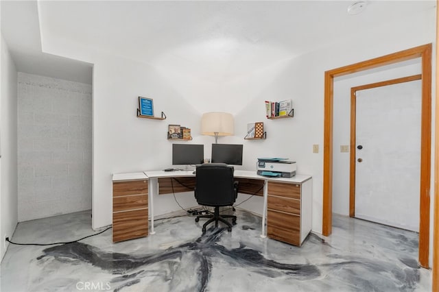 office space with concrete flooring