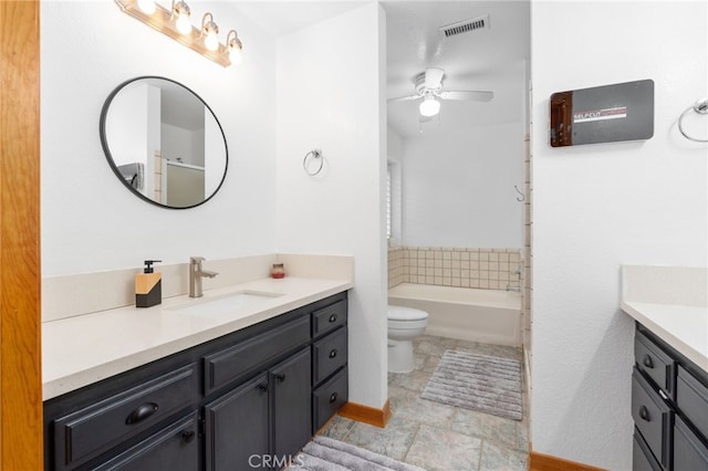 full bathroom with vanity, a ceiling fan, visible vents, a shower, and toilet