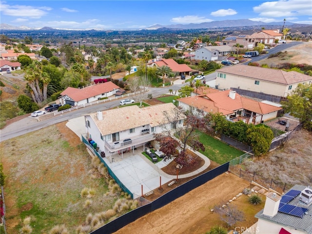 birds eye view of property with a mountain view and a residential view