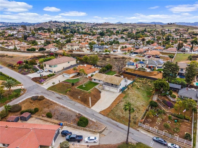 birds eye view of property with a residential view and a mountain view