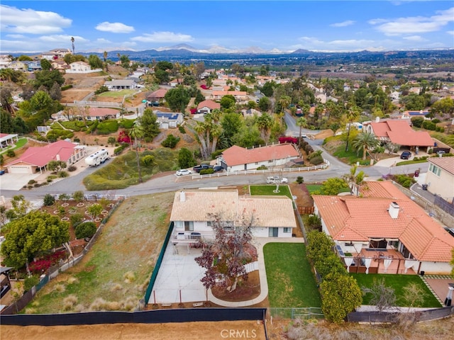 birds eye view of property with a mountain view and a residential view