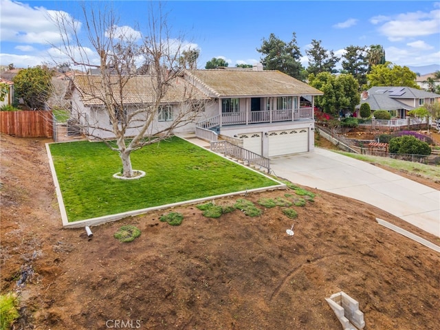 view of front of home with driveway, a porch, stairway, a front yard, and a garage